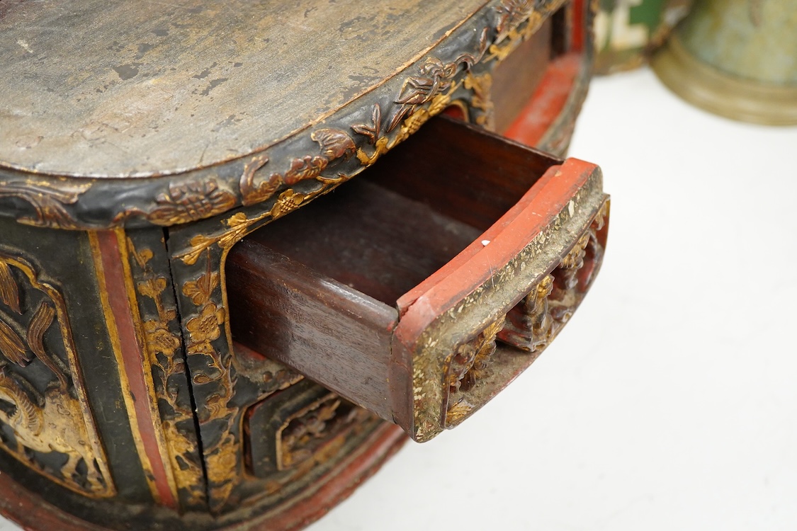 A Chinese carved carved and giltwood stand containing drawers, 38cm wide